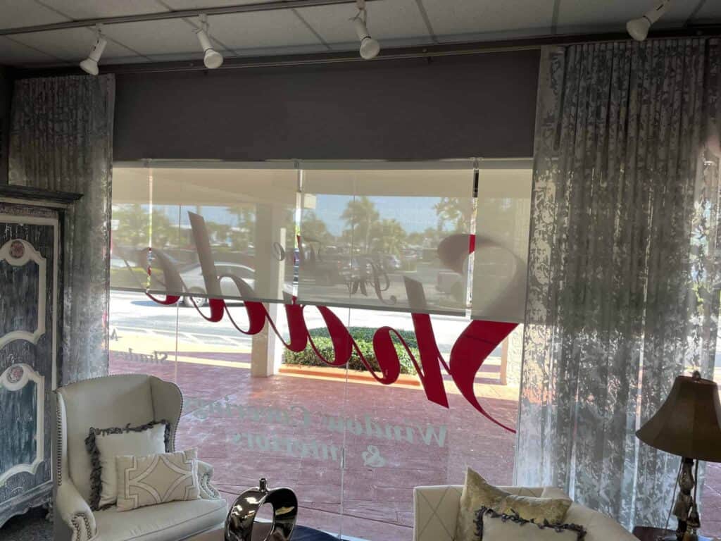 Bright interior with window display, casual seating, and natural light, showcasing a welcoming atmosphere for a retail store or boutique.