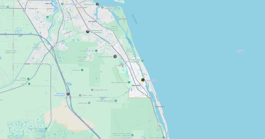 Detailed map showing roads, highways, and landmarks along the coast, including green areas and water bodies.