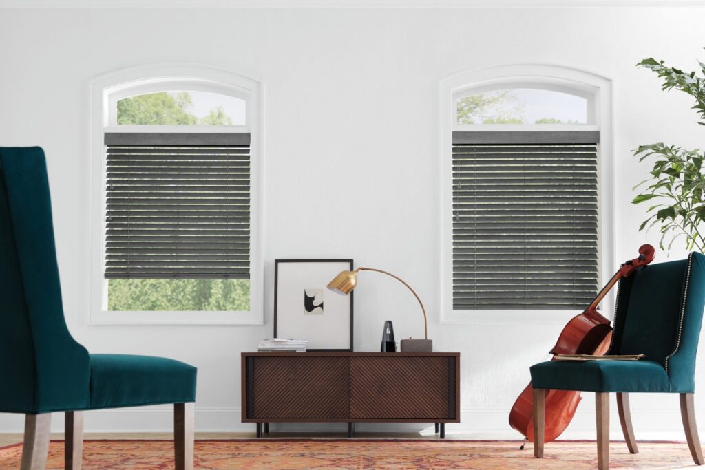 Specialty shape Parkland® Wood Blinds with LiteRise® cordless lift in a music room